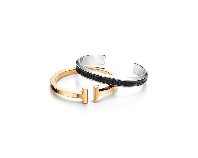 Palomaظ_آs Caliper cuff in stainless steel and midnight titanium and Tiffany T square bracelet in 18 karat gold